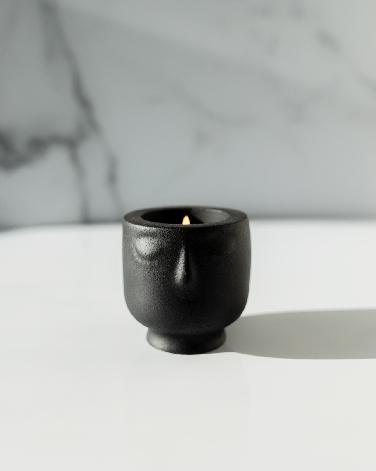 Live By The Sun Coconut Soy Candle -  Modern Face Vessel Noir